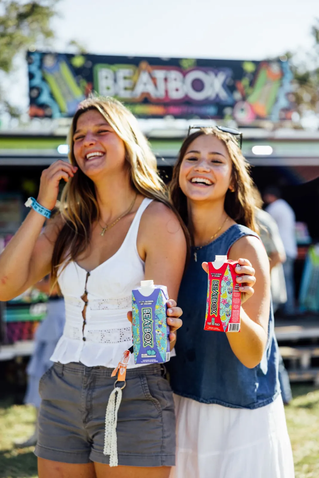 Fans holding BeatBox drinks at a festival sponsorship sampling activation